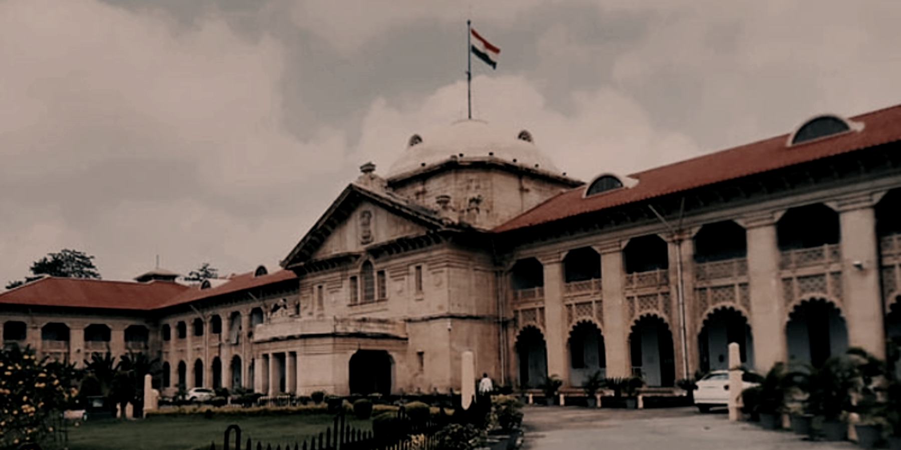 Allahabad High Court frontage treated as a dark institutional hero image