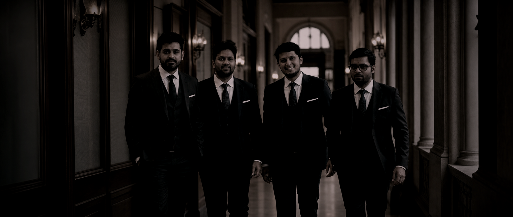 Four Lawbridge Partners in a court corridor, treated as a dark silhouette